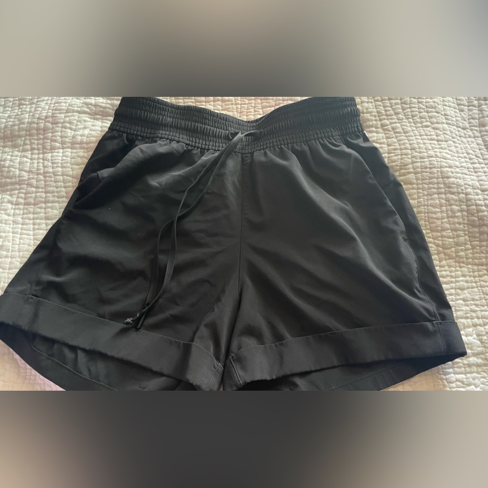 Lululemon Athletica Black Athletic Shorts with Elastic Waistband and pockets.